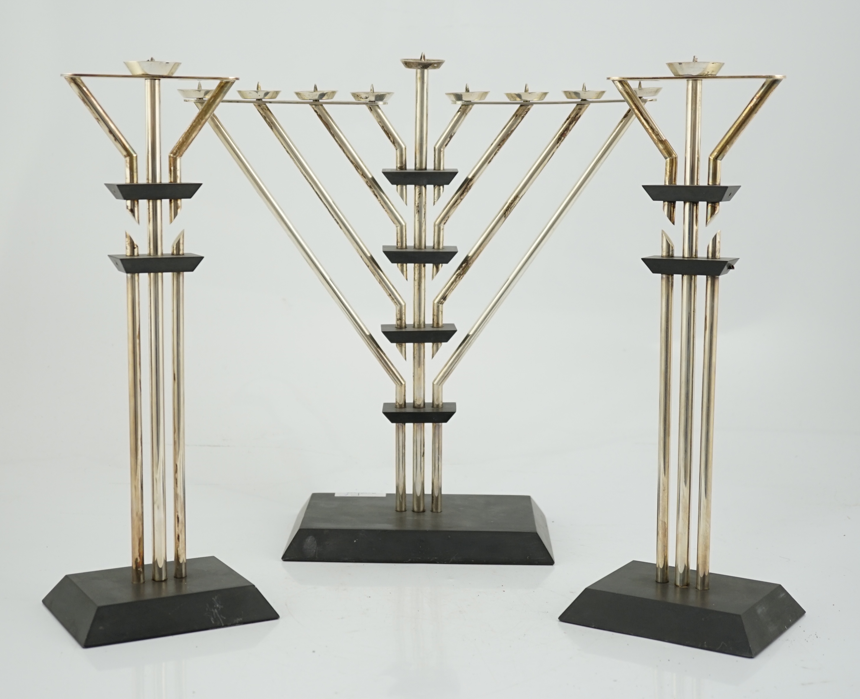 An Elizabeth II silver mounted slate Hanukkah Menorah and a pair of matching candlesticks by Marianne Forest